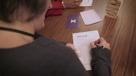 a player filling in a character sheet